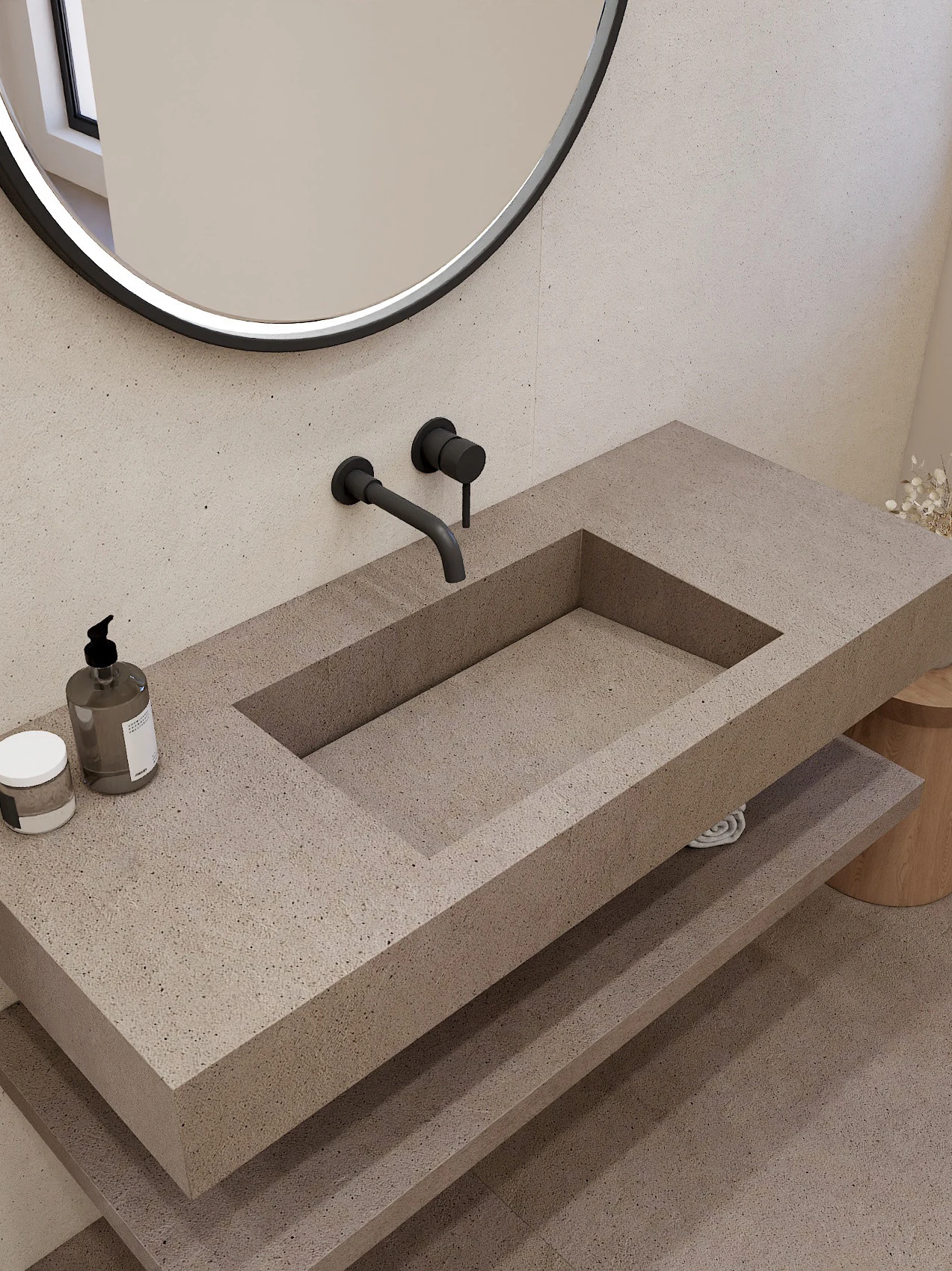 Porcelain bathroom washbasin with a round mirror and warm neutral surfaces